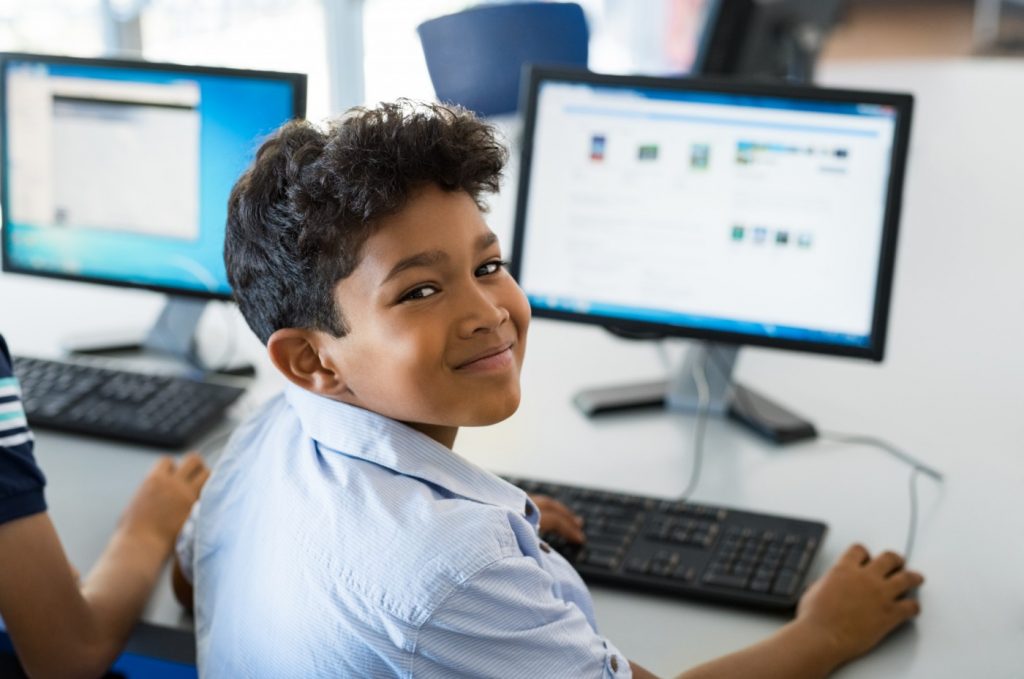 school boy using computer 1